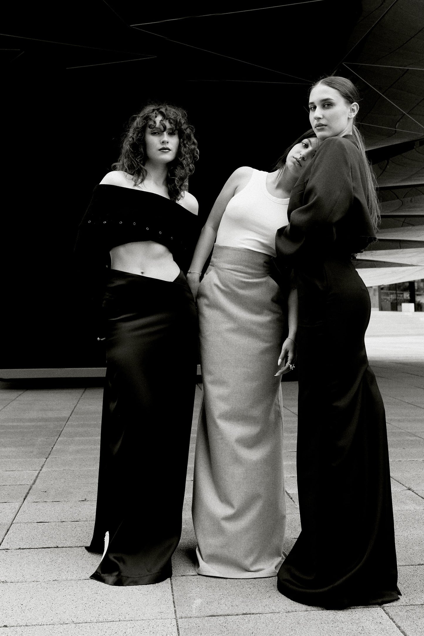 ASYMMETRIC SATIN SKIRT. BLACK