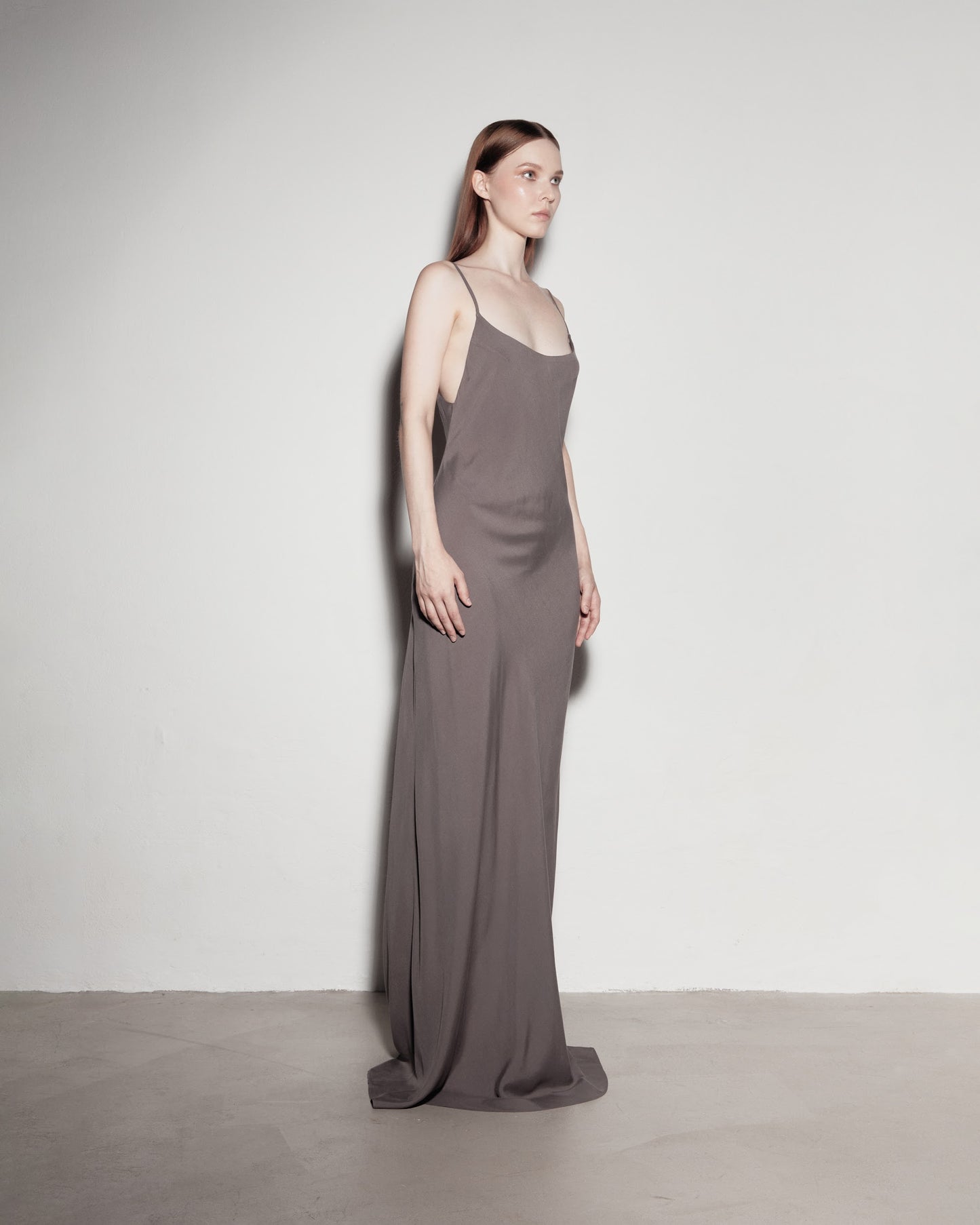 Max's dress with her back exposed. Gray