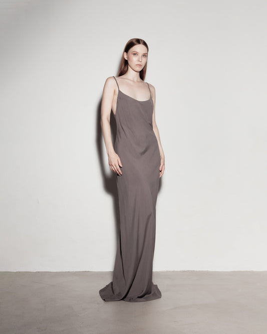 Max's dress with her back exposed. Gray