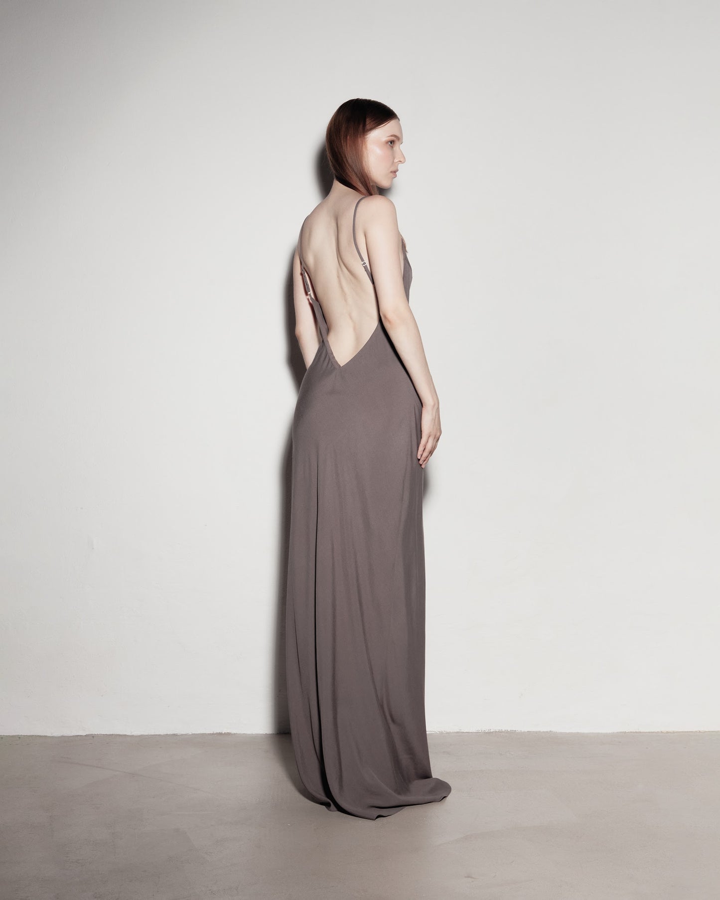 Max's dress with her back exposed. Gray