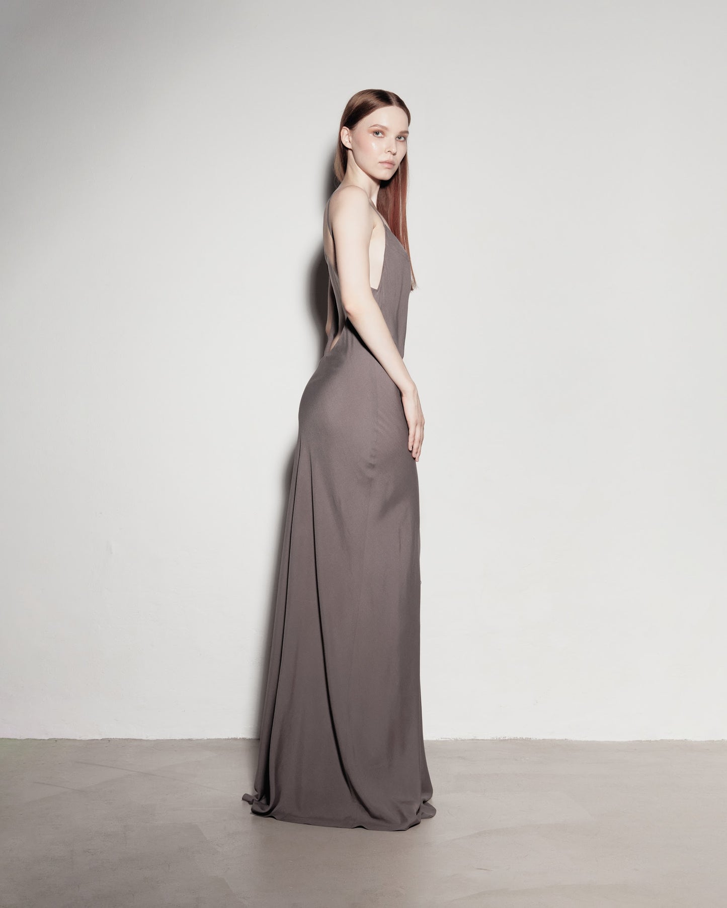 Max's dress with her back exposed. Gray