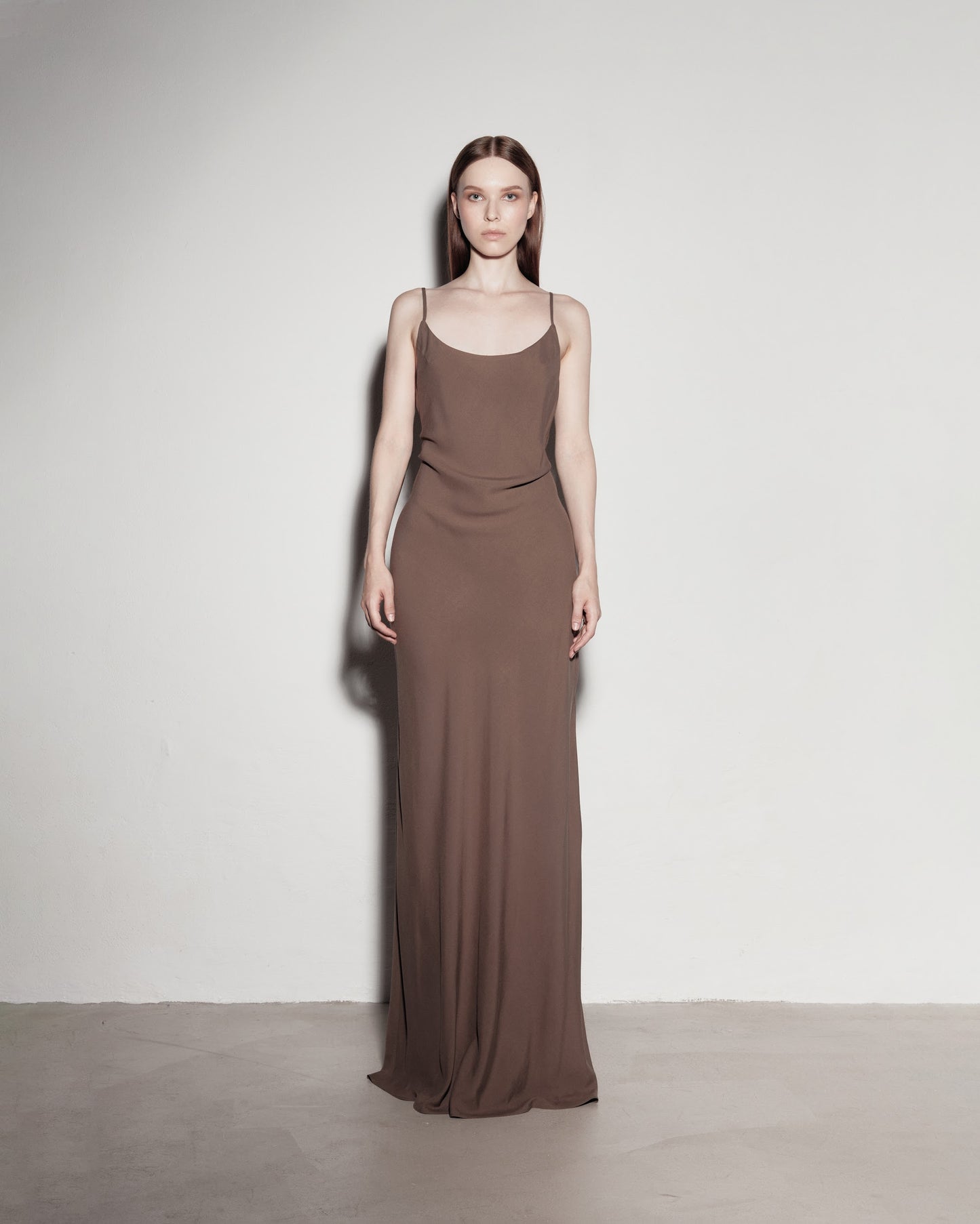Max's dress with her back exposed. Brown