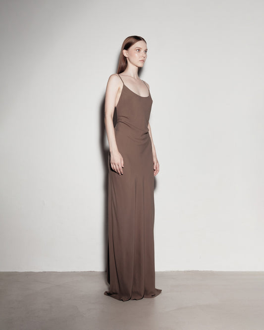 Max's dress with her back exposed. Brown