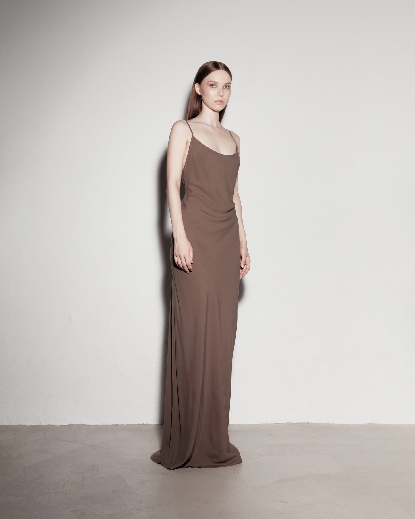 Max's dress with her back exposed. Brown