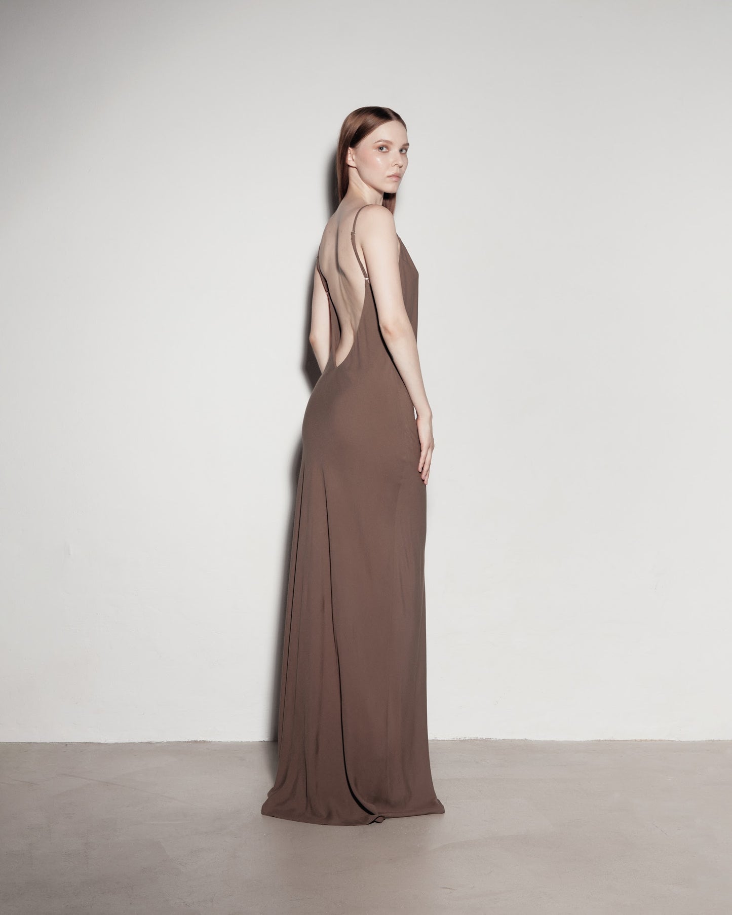 Max's dress with her back exposed. Brown